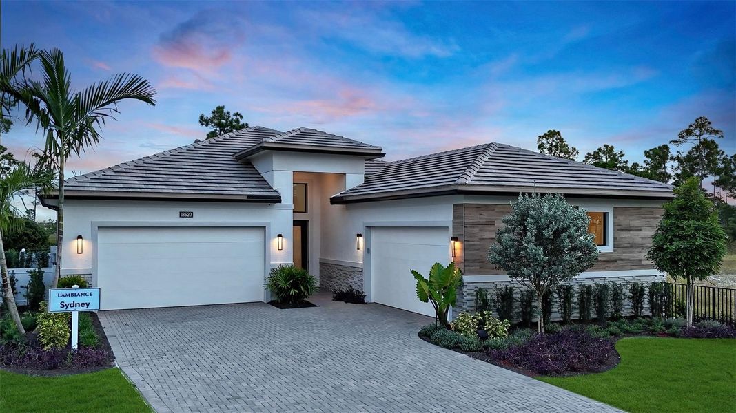 Front exterior of a new home in L'Ambiance at Avenir, Palm Beach Gardens, FL, highlighting curb appeal (Image 20).