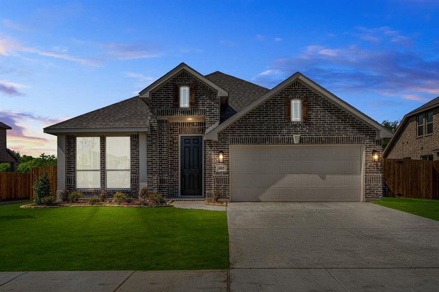 Front exterior of a new home in Sable Creek, Sanger, TX, highlighting curb appeal (Image 24). Front exterior of a new home in Sable Creek, Sanger, TX, highlighting curb appeal (Image 24).
