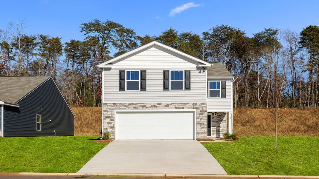 Front exterior of a new home in Durbin Meadows, Fountain Inn, SC, highlighting curb appeal (Image 1). Front exterior of a new home in Durbin Meadows, Fountain Inn, SC, highlighting curb appeal (Image 1).