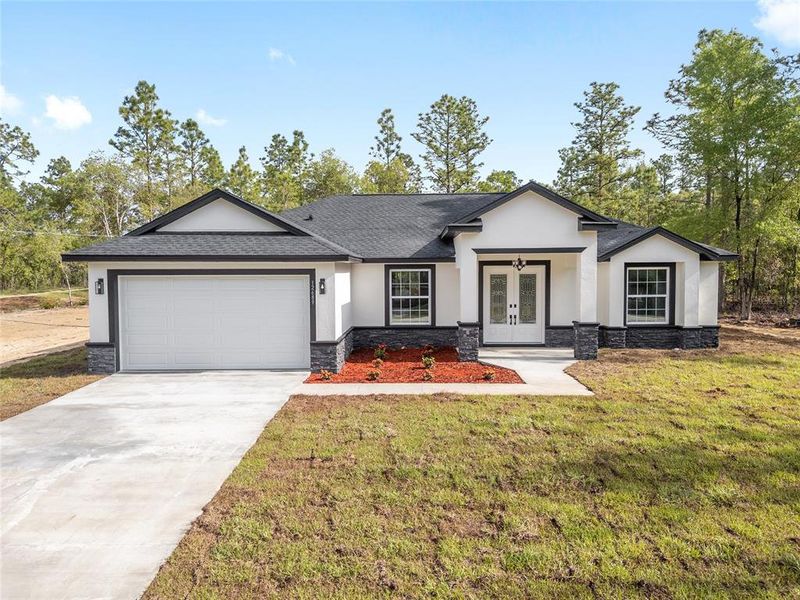 Front exterior of a new home in , Dunnellon, FL, highlighting curb appeal (Image 35).