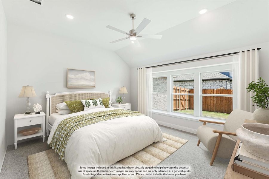 Bedroom with vaulted ceiling, ceiling fan, large window, and carpeted floor with staged furnishings Bedroom with vaulted ceiling, ceiling fan, large window, and carpeted floor with staged furnishings