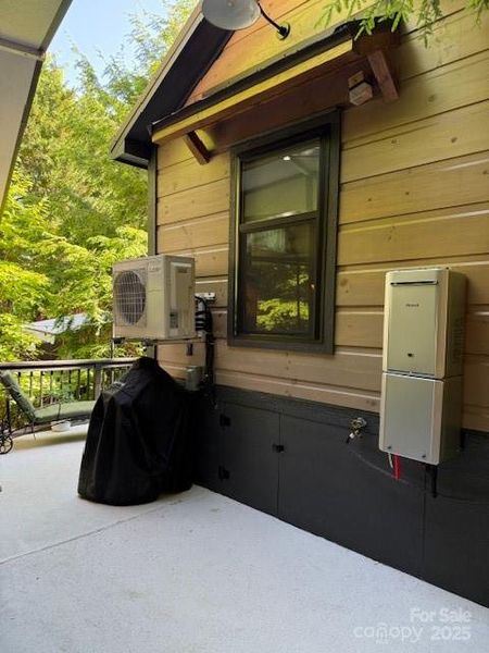 Back of home with tankless water heater