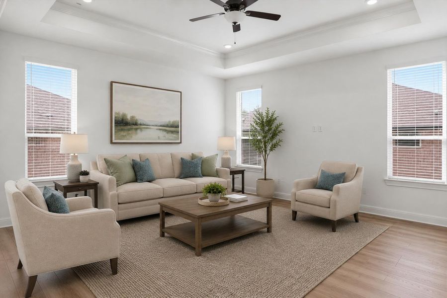 Virtually staged. An inviting gathering space showcases tray ceilings, recessed lighting, and rich hardwood flooring, ready for comfortable living. Virtually staged. An inviting gathering space showcases tray ceilings, recessed lighting, and rich hardwood flooring, ready for comfortable living.
