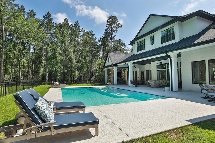 Another view of the fenced back yard and the pool area! The sprinkler system will help you keep your yard watered!