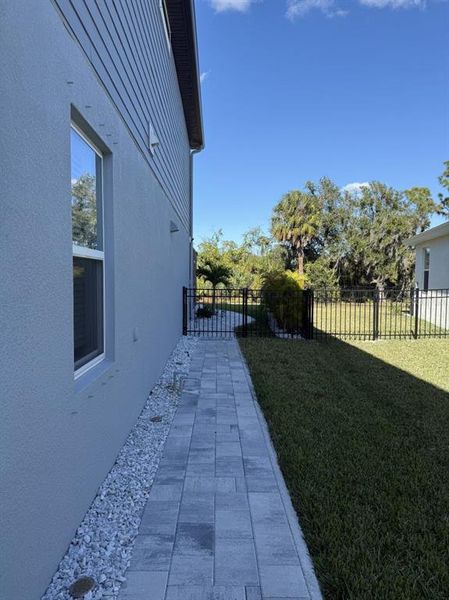 Exterior details and patio area of a home in Isles at BayView, Parrish (Image 25).