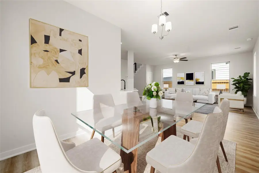 This inviting dining area flows effortlessly into the main living space, offering a bright and open layout enhanced by large windows that fill the room with natural light. Neutral tones and modern finishes create a timeless atmosphere, while the spacious design provides versatility for both everyday meals and special gatherings. The soft lighting and clean lines add a touch of sophistication, making this an ideal setting for relaxed, comfortable living. This inviting dining area flows effortlessly into the main living space, offering a bright and open layout enhanced by large windows that fill the room with natural light. Neutral tones and modern finishes create a timeless atmosphere, while the spacious design provides versatility for both everyday meals and special gatherings. The soft lighting and clean lines add a touch of sophistication, making this an ideal setting for relaxed, comfortable living.