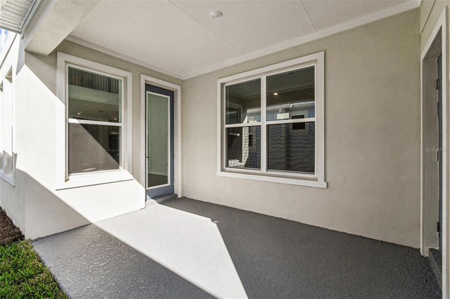 Exterior details and patio area of a home in Laureate Park at Lake Nona - Garden Series, Orlando (Image 3).