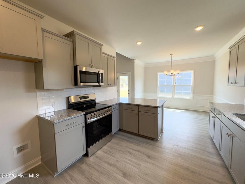 Furnished interior view inside a new home in East Lake, Leland (Image 6).