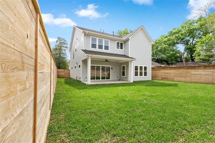 The large covered patio is spacious enough for outdoor furniture and is pre-plumbed for water and a gas line. You'll love the expansive backyard!