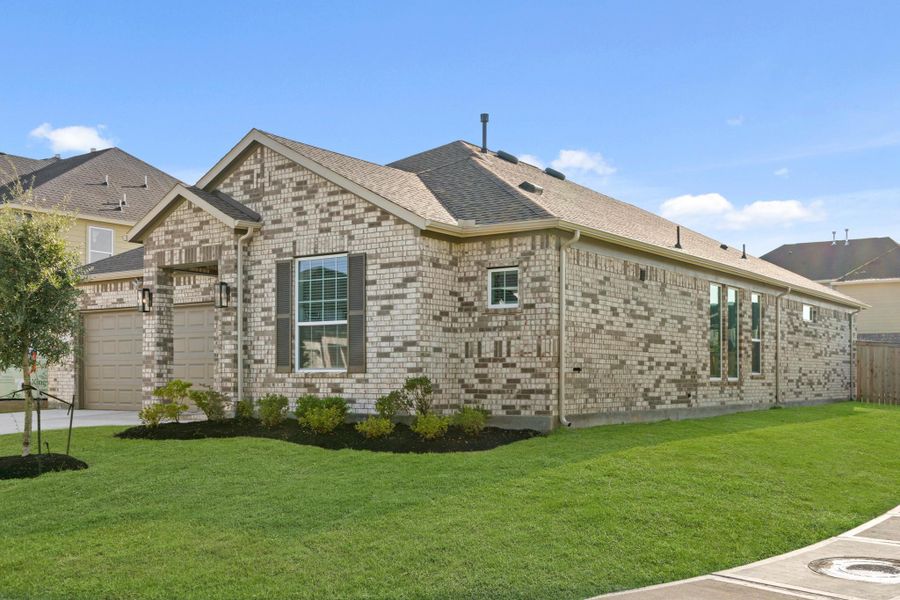 Front exterior of a new home in Beacon Hill, Waller, TX, highlighting curb appeal (Image 17).