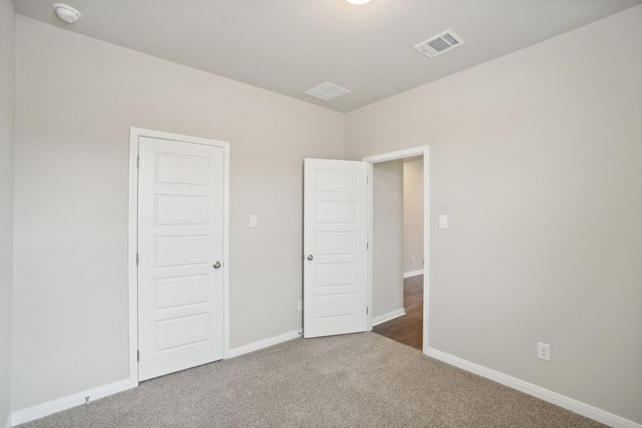 Guest bedroom in a Rio Grande floorplan at a Meritage Homes community.