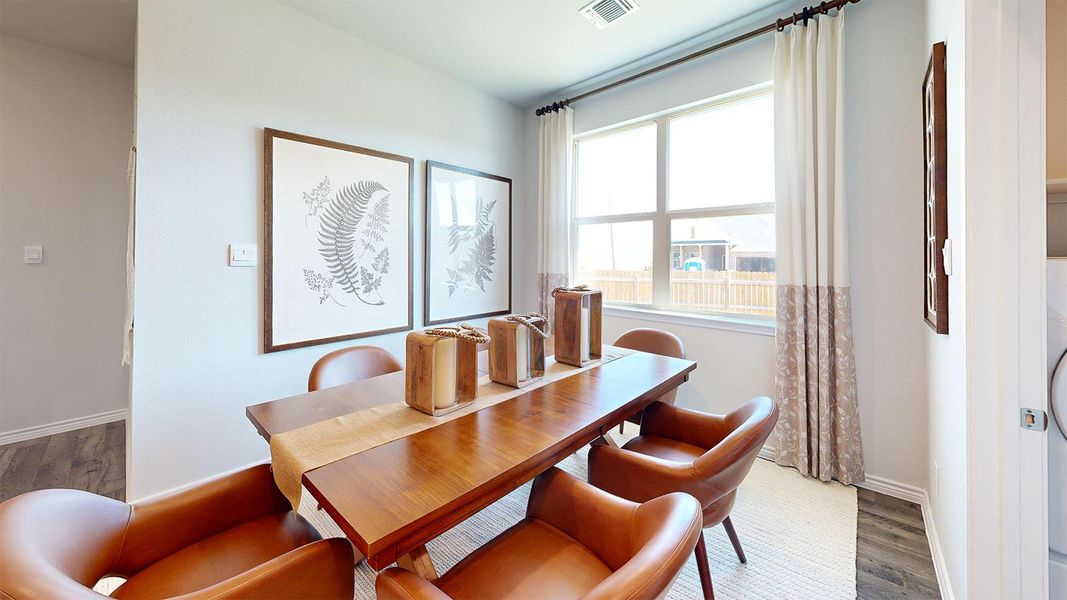 Dining area featuring wood finished floors and baseboards Dining area featuring wood finished floors and baseboards