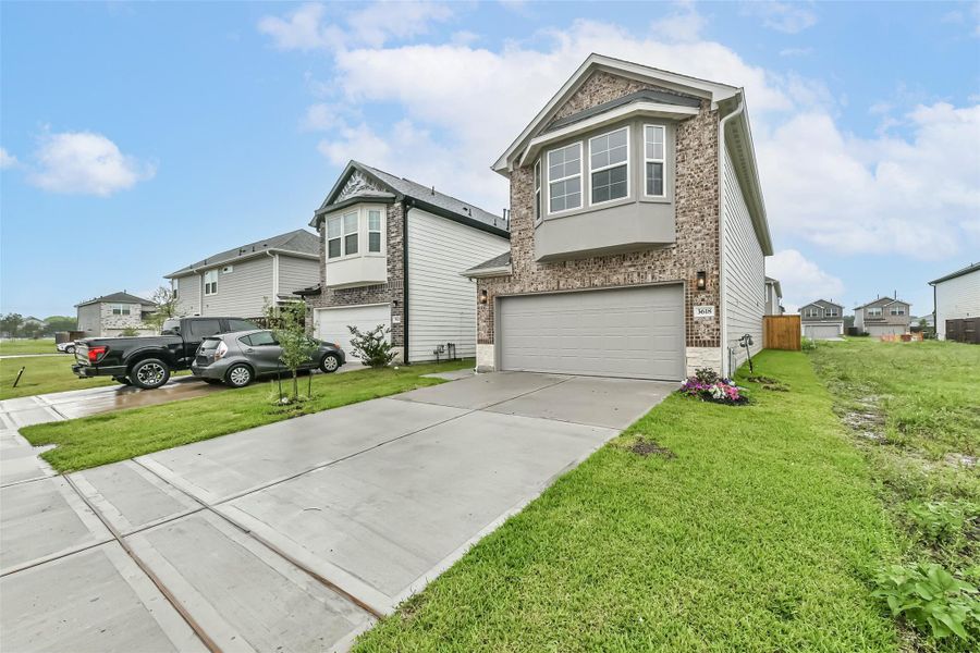 Front exterior of a new home in , Missouri City, TX, highlighting curb appeal (Image 22).