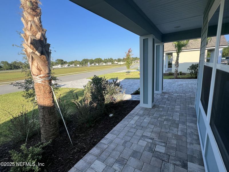 Exterior details and patio area of a home in American Village, Palm Coast (Image 4).