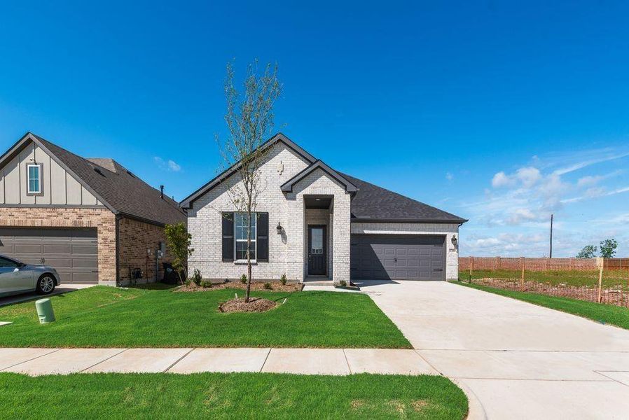 Front exterior of a new home in Walden Pond, Forney, TX, highlighting curb appeal (Image 21).