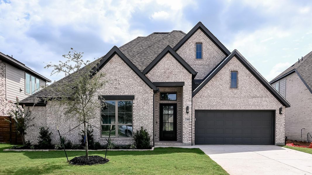 Front exterior of a new home in Juniper Springs, Lockhart, TX, highlighting curb appeal (Image 2). Front exterior of a new home in Juniper Springs, Lockhart, TX, highlighting curb appeal (Image 2).