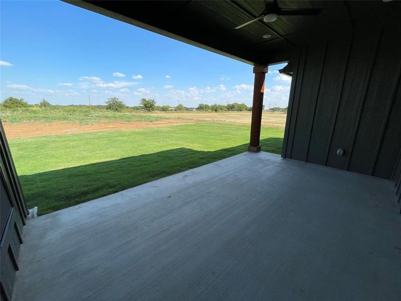 View of patio featuring ceiling fan