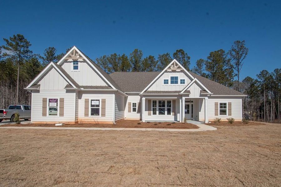 Front exterior of a new home in Highgate, Newnan, GA, highlighting curb appeal (Image 11). Front exterior of a new home in Highgate, Newnan, GA, highlighting curb appeal (Image 11).