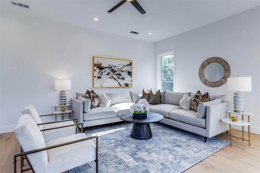 Living room with light hardwood / wood-style floors