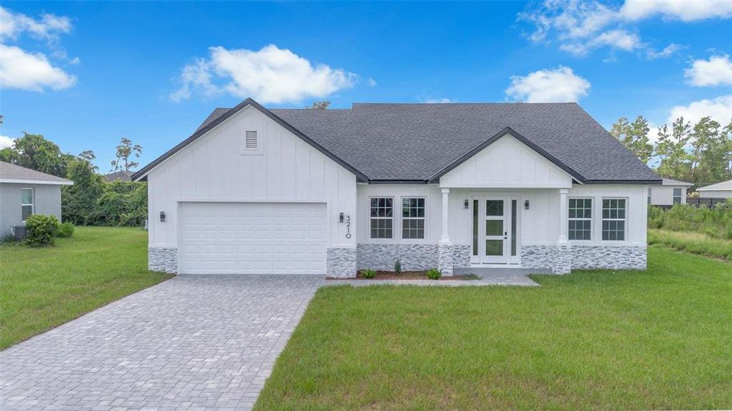 Front exterior of a new home in , Ocala, FL, highlighting curb appeal (Image 20).