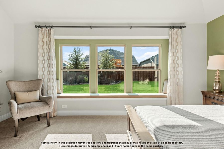 Bedroom with triple windows, window seat, accent chair, and backyard view through patterned curtains Bedroom with triple windows, window seat, accent chair, and backyard view through patterned curtains