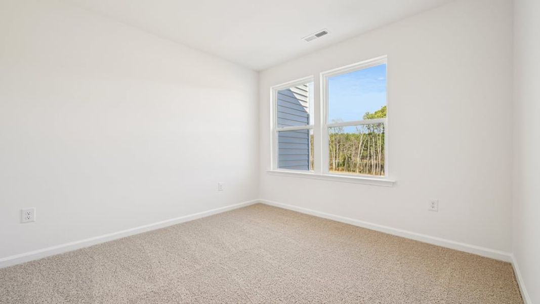 Spacious, unfurnished interior of a new home in Chapel Townes, Raleigh (Image 24).