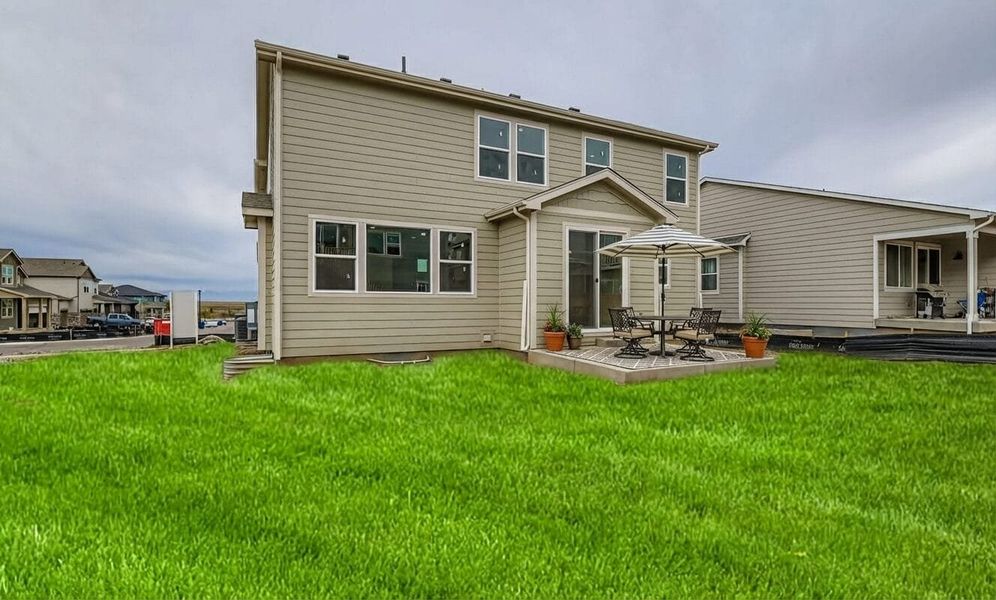 Exterior details and patio area of a home in Buffalo Highlands – Commerce City, Commerce City (Image 4).