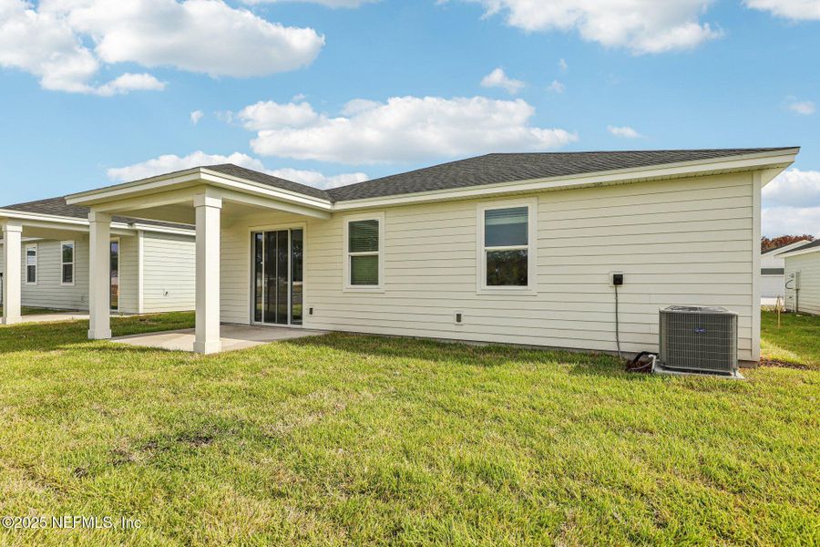 Exterior details and patio area of a home in Cypress Meadows - Signature Series, Jacksonville (Image 3).