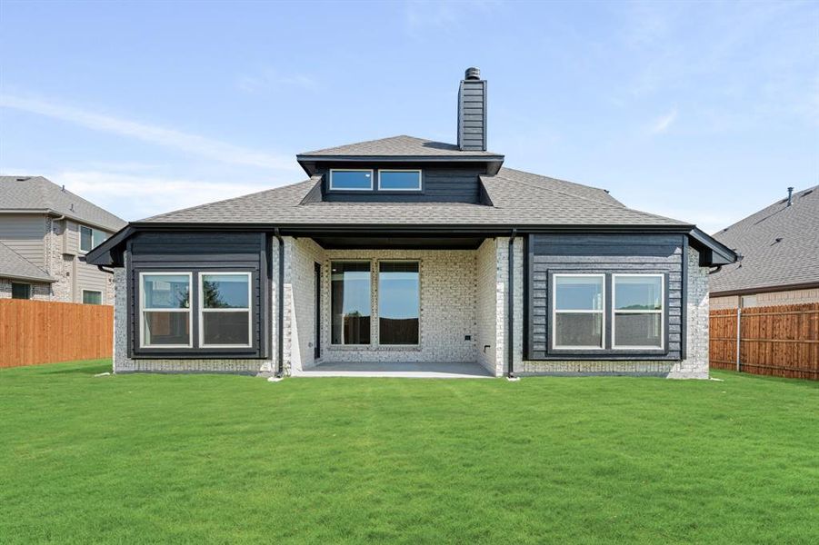 Front exterior of a new home in Timberbrook 3B-4A, Justin, TX, highlighting curb appeal (Image 1).