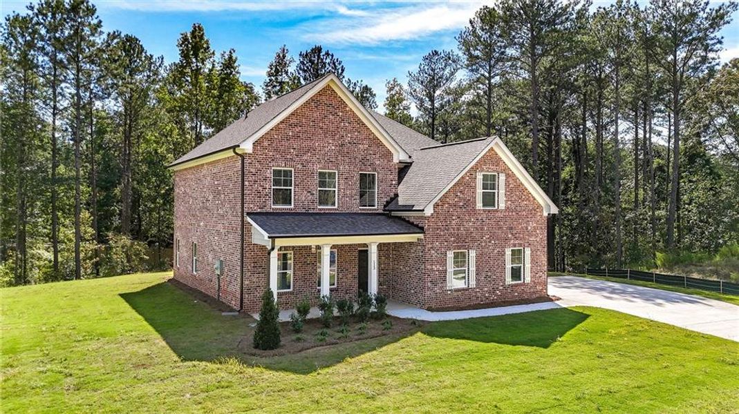 Front exterior of a new home in , Ellenwood, GA, highlighting curb appeal (Image 13).