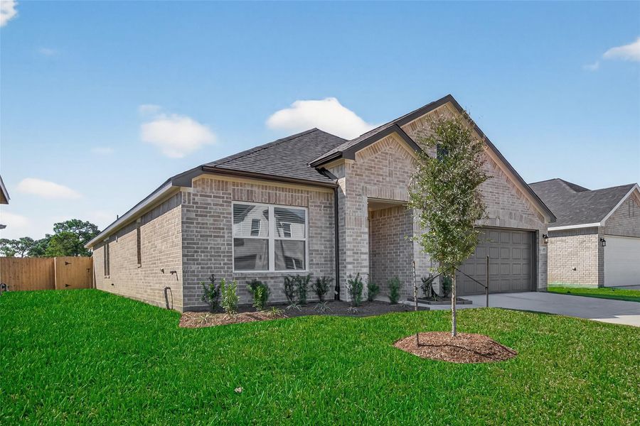 Front exterior of a new home in Rollingbrook Estates, Baytown, TX, highlighting curb appeal (Image 25).
