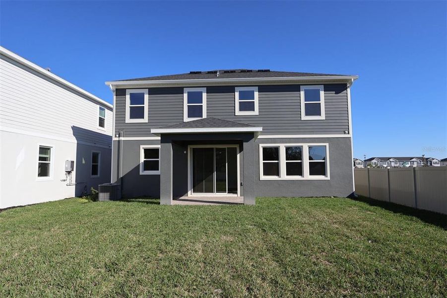 Exterior details and patio area of a home in Center Lake on the Park, St. Cloud (Image 3).