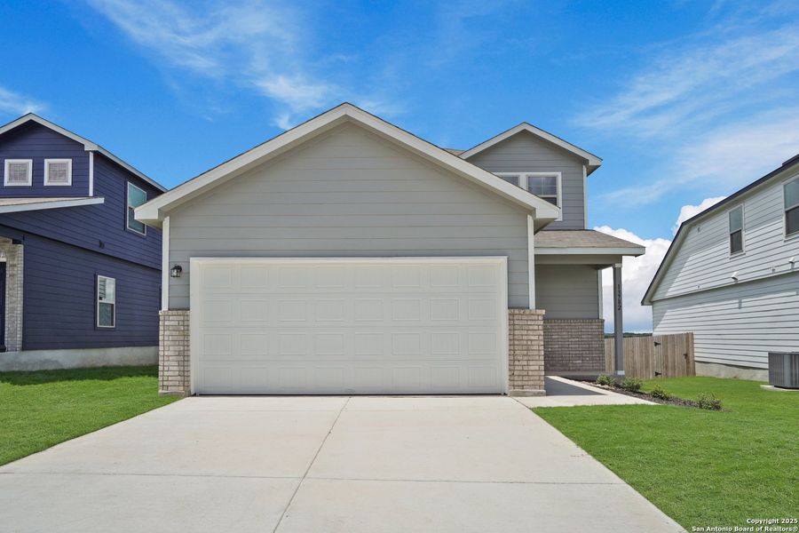 Front exterior of a new home in Cinco Lakes, San Antonio, TX, highlighting curb appeal (Image 1). Front exterior of a new home in Cinco Lakes, San Antonio, TX, highlighting curb appeal (Image 1).