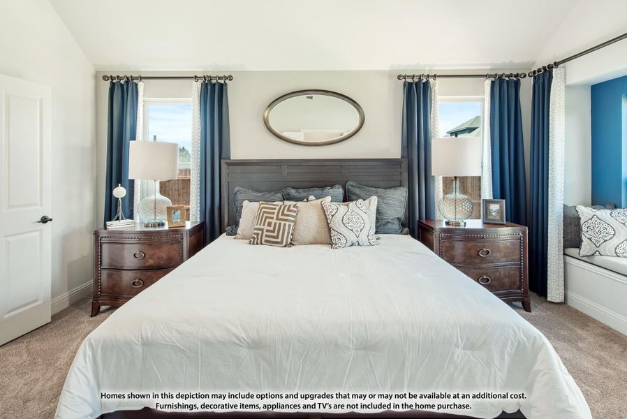 Bedroom with gray upholstered headboard, wood nightstands, blue curtains, and oval mirror above the bed