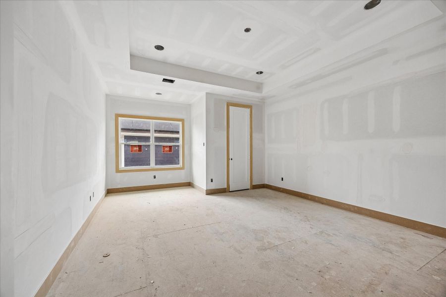 Spacious secondary bedroom with tray ceiling detail and a deep set window that draws in soft natural light. Generous wall space allows for flexible furniture placement while maintaining a bright, airy feel. Spacious secondary bedroom with tray ceiling detail and a deep set window that draws in soft natural light. Generous wall space allows for flexible furniture placement while maintaining a bright, airy feel.