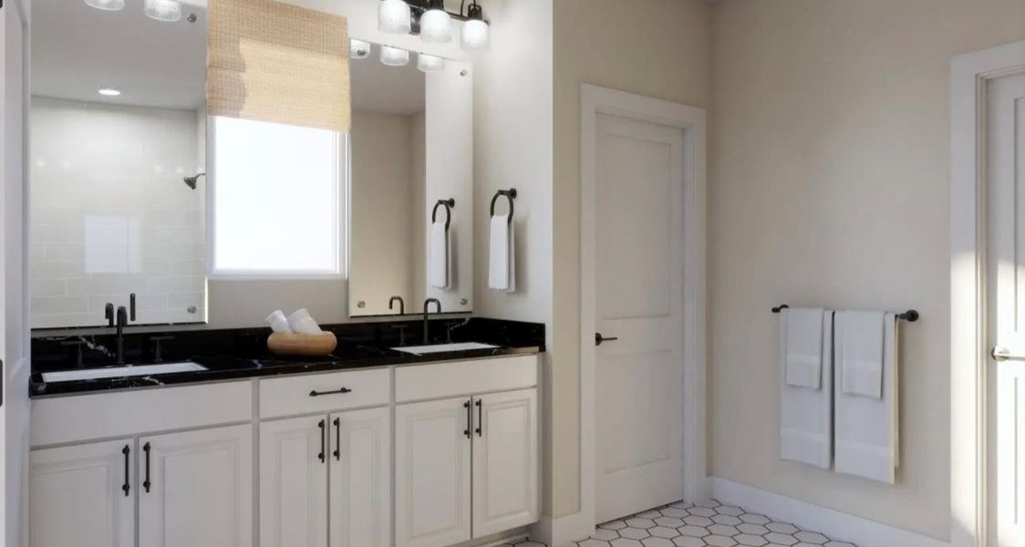 Full bathroom featuring double vanity and baseboards