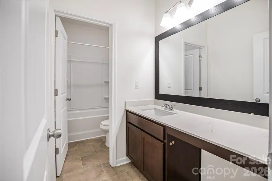 Furnished interior view inside a new home in Wilora Pond, Charlotte (Image 8).