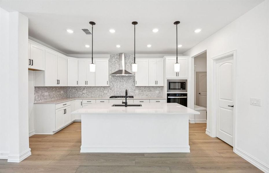 Spacious kitchen with eat-in bartop island Spacious kitchen with eat-in bartop island