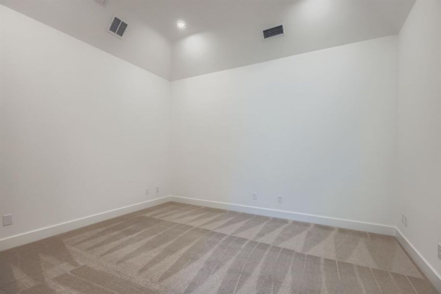 Spare room with light carpet and recessed lighting Spare room with light carpet and recessed lighting