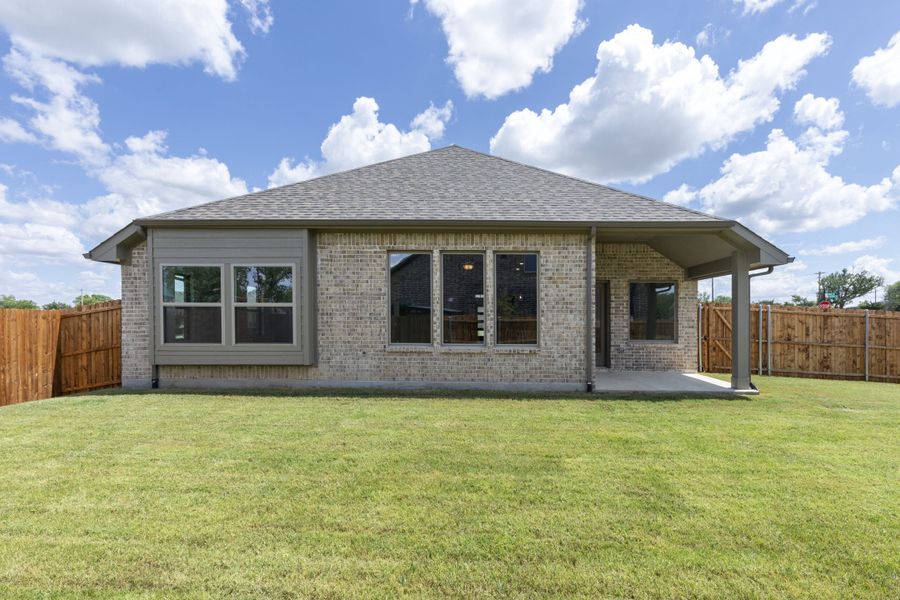 Exterior details and patio area of a home in Keeneland, Aubrey (Image 4).