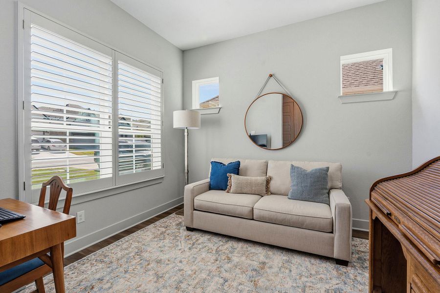 Sitting room with baseboards and wood finished floors Sitting room with baseboards and wood finished floors