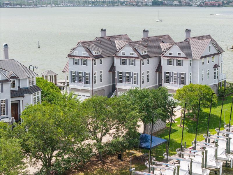 One of the three pictured new construction homes built on private Lakewood Pointe behind the guarded gates of Lakewood Yacht Club. 2451 is the townhome on the right.