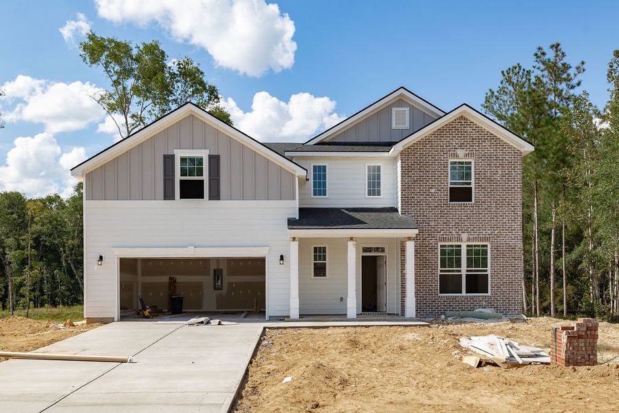Front exterior of a new home in Ramsey Landing, Rincon, GA, highlighting curb appeal (Image 1).