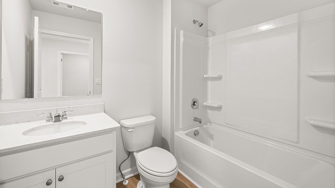 Representative furnished interior of a home built from the AMESBURY by D.R. Horton in Waypoint, Flowery Branch (Image 12).