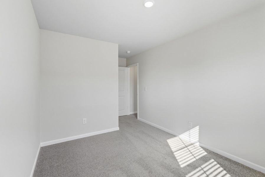 Representative unfurnished interior of a home built from the Palmetto II by McGuinn Homes in Clarke Townes, Anderson (Image 62).