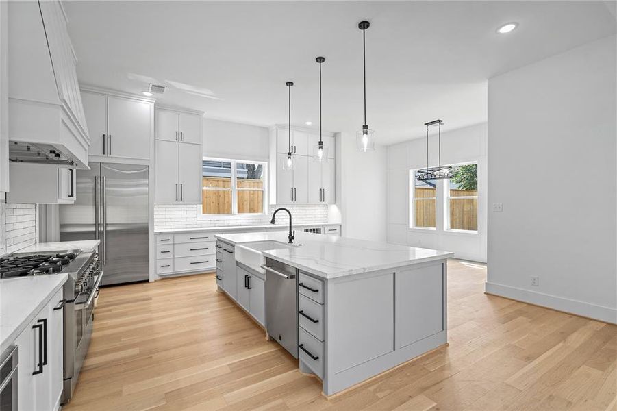 The kitchen is both beautiful and functional, with ample space for two people to work at once! The dining area is in view on the right hand side