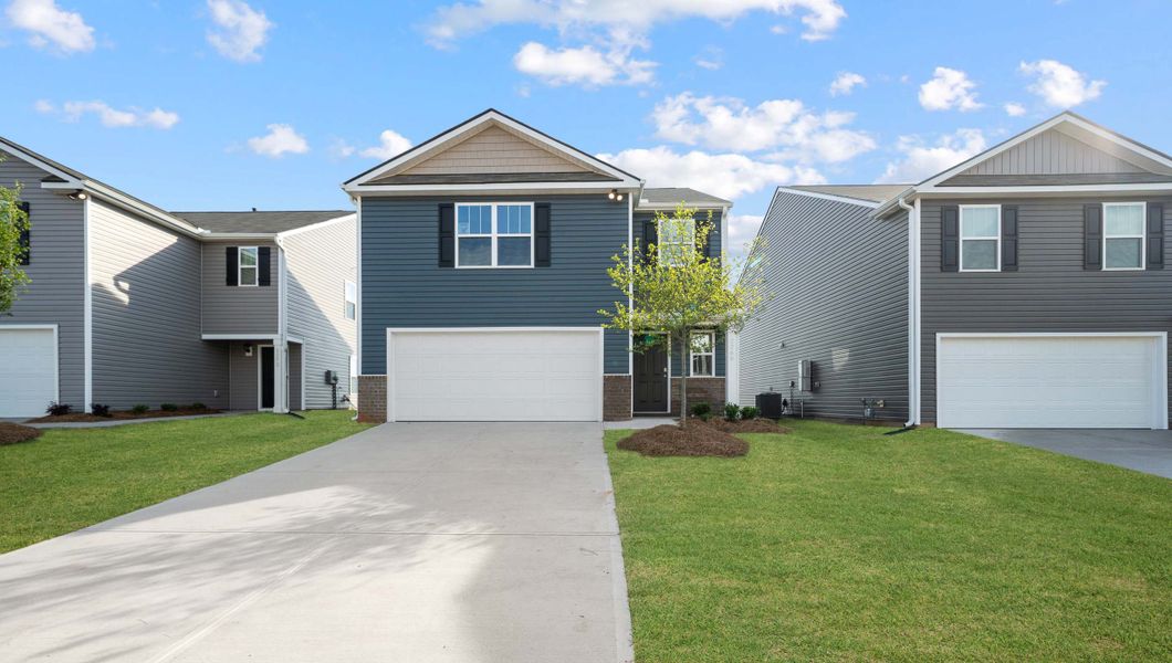 Front exterior of a new home in Durbin Meadows, Fountain Inn, SC, highlighting curb appeal (Image 1). Front exterior of a new home in Durbin Meadows, Fountain Inn, SC, highlighting curb appeal (Image 1).