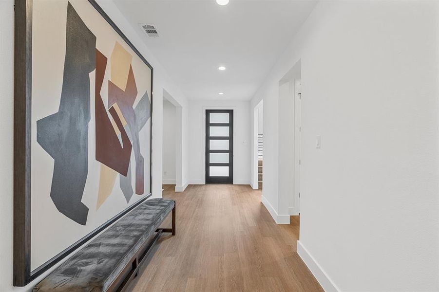 Hallway featuring light wood-type flooring