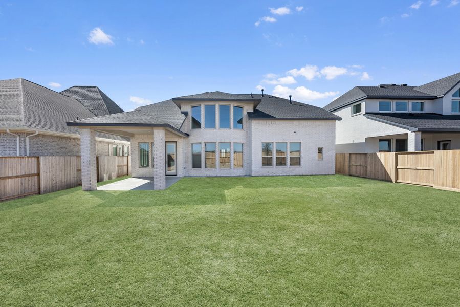 Exterior details and patio area of a home in Meridiana, Manvel (Image 4).