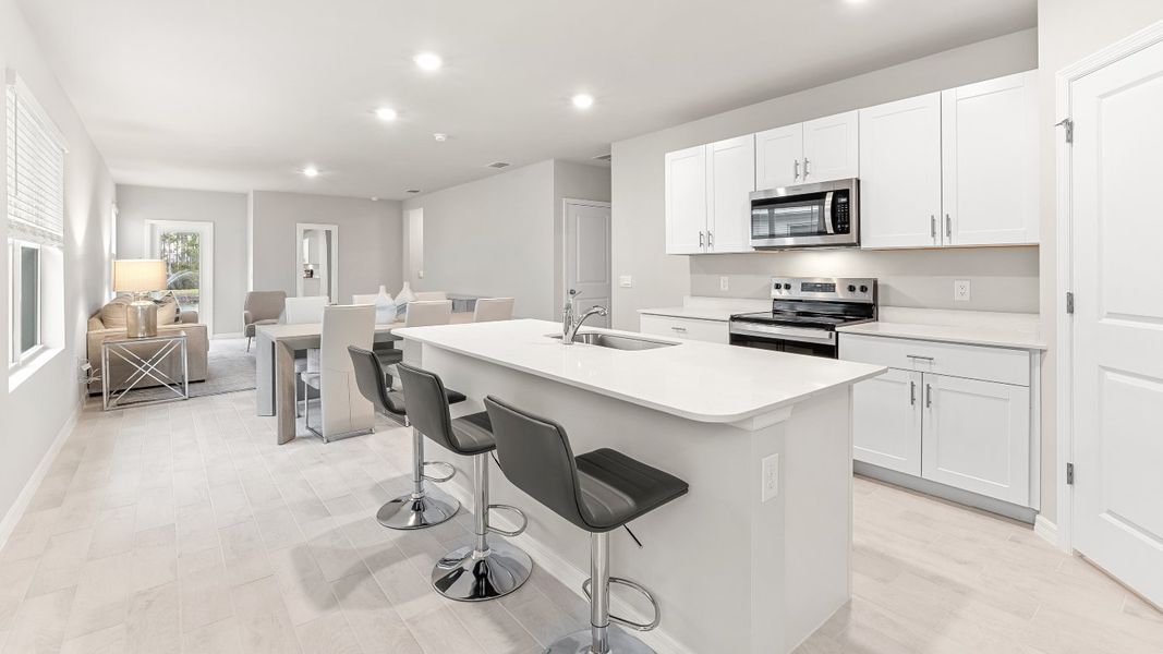 Furnished interior view inside a new home in Coral Bay - Express & Tradition, North Fort Myers (Image 7).